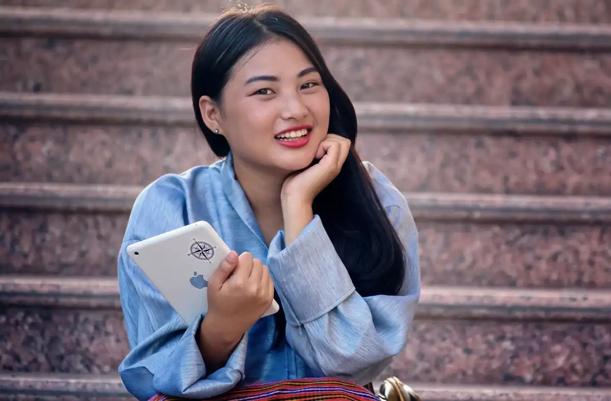 An international student on the campus steps between classes